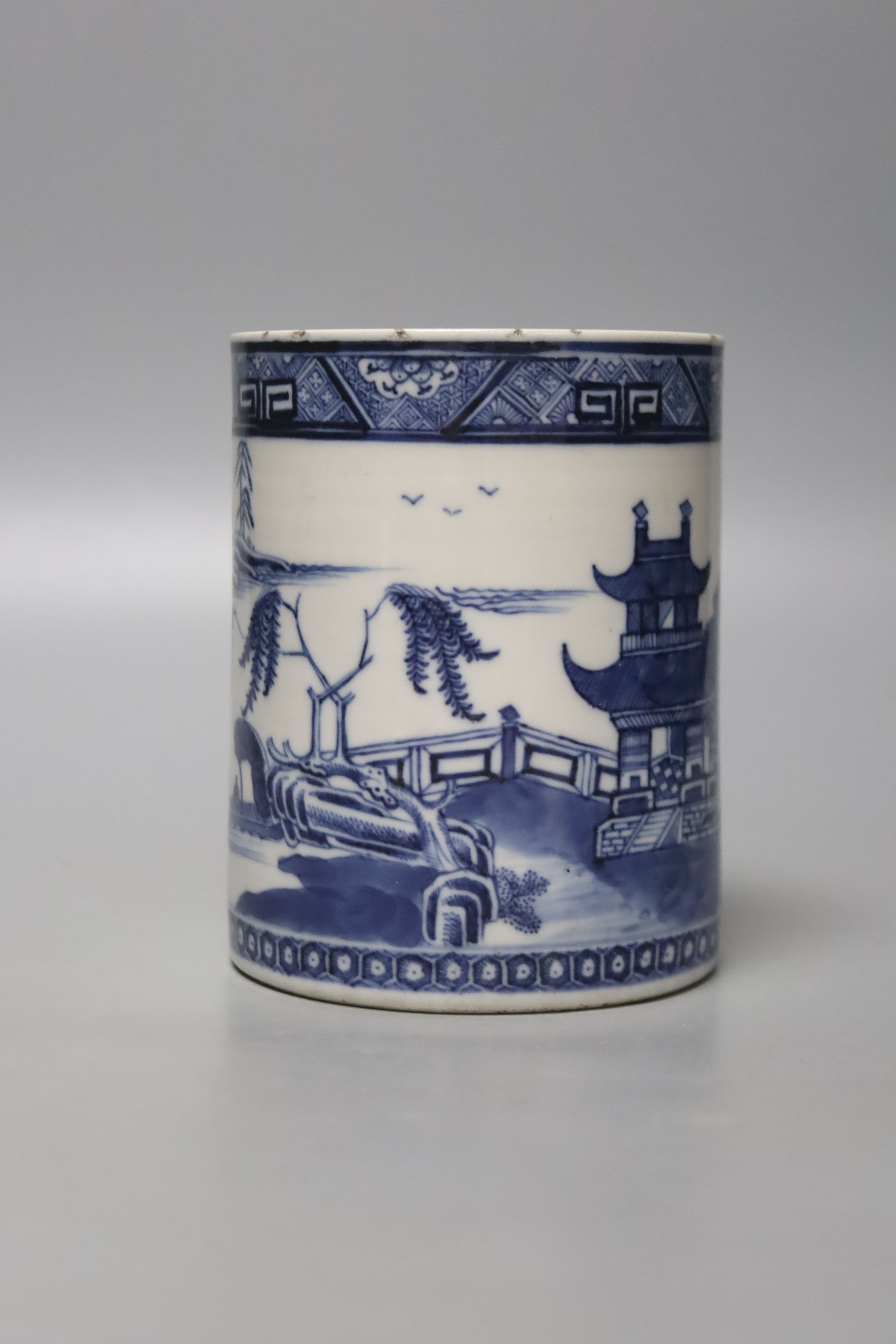 A late 18th century Chinese export blue and white cylindrical mug, with entwined handle, 13cm